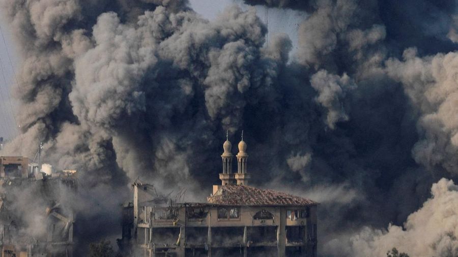FILE PHOTO: Smoke billows following Israeli strikes on the Islamic University of Gaza (IUG), amid the ongoing conflict between Israel and Hamas, in Gaza City, October 11, 2023. REUTERS/Saleh Salem/File Photo