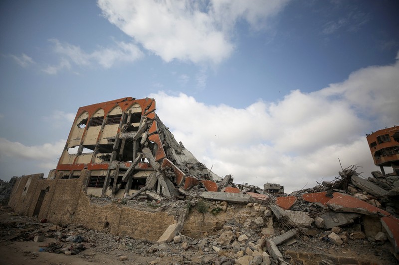 FILE PHOTO: Smoke billows following Israeli strikes on the Islamic University of Gaza (IUG), amid the ongoing conflict between Israel and Hamas, in Gaza City, October 11, 2023. REUTERS/Saleh Salem/File Photo