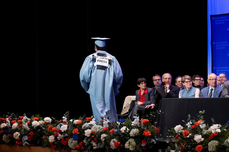 ISRAEL-PALESTINIANS/USA A student holds up her graduation hat with a message supporting her colleagues after receiving a diploma during a graduation ceremony at Columbia University Journalism School, during the ongoing conflict between Israel and the Palestinian Islamist group Hamas, in New York City, U.S., May 15, 2024. REUTERS/Caitlin Ochs