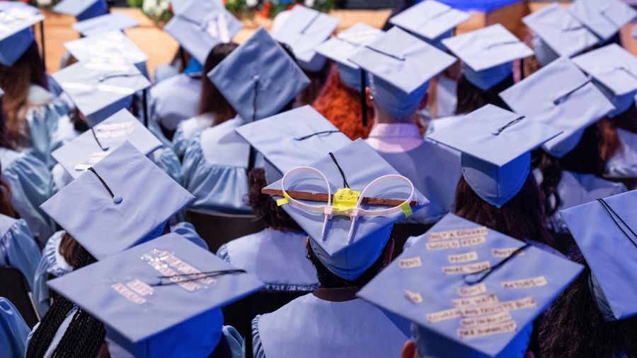 Students wear statements in support of colleagues during a graduation ceremony at Columbia University Journalism School, during the ongoing conflict between Israel and the Palestinian Islamist group Hamas, in New York City, U.S., May 15, 2024.  REUTERS/Caitlin Ochs