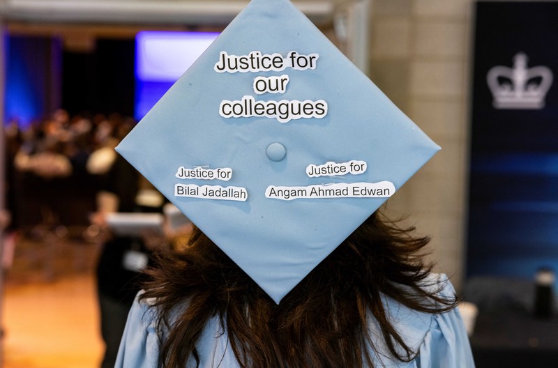 ISRAEL-PALESTINIANS/USA A student holds up her graduation hat with a message supporting her colleagues after receiving a diploma during a graduation ceremony at Columbia University Journalism School, during the ongoing conflict between Israel and the Palestinian Islamist group Hamas, in New York City, U.S., May 15, 2024. REUTERS/Caitlin Ochs