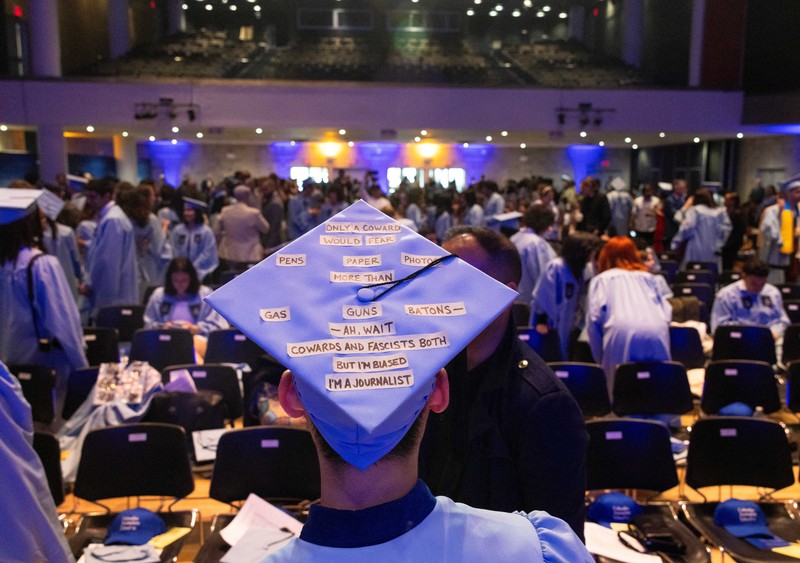 ISRAEL-PALESTINIANS/USA A student holds up her graduation hat with a message supporting her colleagues after receiving a diploma during a graduation ceremony at Columbia University Journalism School, during the ongoing conflict between Israel and the Palestinian Islamist group Hamas, in New York City, U.S., May 15, 2024. REUTERS/Caitlin Ochs