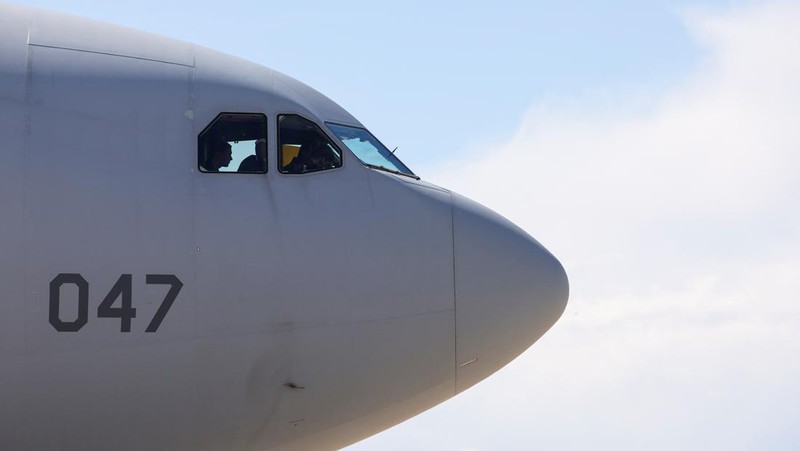 People line up as civil guards, police officers and sailors firefighters board a plane of the French Air Force at Istres military airbase after France declared a state of emergency to regain control of events in New Caledonia, near Marseille, France, May 16, 2024. REUTERS/Manon Cruz REFILE - CORRECTING FROM 