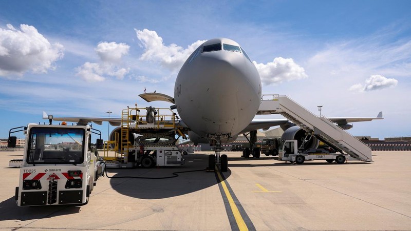 People line up as civil guards, police officers and sailors firefighters board a plane of the French Air Force at Istres military airbase after France declared a state of emergency to regain control of events in New Caledonia, near Marseille, France, May 16, 2024. REUTERS/Manon Cruz REFILE - CORRECTING FROM 