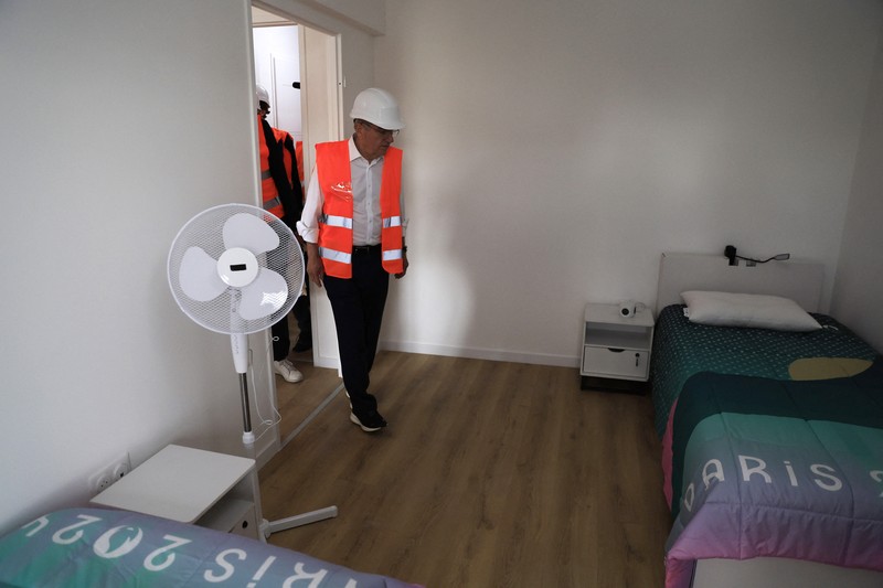 Paris 2024 Olympic Village International Olympic Committee (IOC) president Thomas Bach enters a room as he visits the Athletes' village in Saint-Ouen-sur-Seine, outside Paris, Tuesday, July 25, 2023. (Pascal Rossignol/Pool via AP)