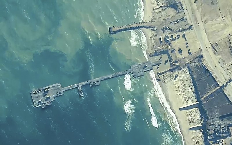 United States Gaza Aid The image provided by U.S, Central Command, shows U.S. Army soldiers assigned to the 7th Transportation Brigade (Expeditionary), U.S. Navy sailors assigned to Amphibious Construction Battalion 1, and Israel Defense Forces placing the Trident Pier on the coast of Gaza Strip on Thursday, May 16, 2024. The temporary pier is part of the Joint Logistics Over-the-Shore capability. The U.S. military finished installing the floating pier on Thursday, with officials poised to begin ferrying badly needed humanitarian aid into the enclave besieged over seven months of intense fighting in the Israel-Hamas war. (U.S. Central Command via AP)