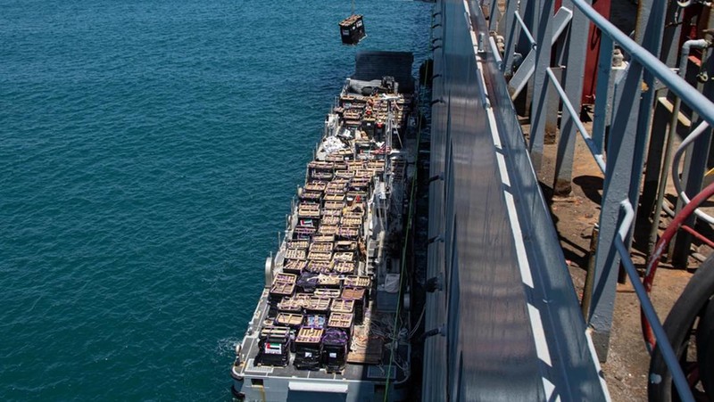 The image provided by U.S, Central Command, shows U.S. Army soldiers assigned to the 7th Transportation Brigade (Expeditionary), U.S. Navy sailors assigned to Amphibious Construction Battalion 1, and Israel Defense Forces placing the Trident Pier on the coast of Gaza Strip on Thursday, May 16, 2024. The temporary pier is part of the Joint Logistics Over-the-Shore capability. The U.S. military finished installing the floating pier on Thursday, with officials poised to begin ferrying badly needed humanitarian aid into the enclave besieged over seven months of intense fighting in the Israel-Hamas war. (U.S. Central Command via AP)