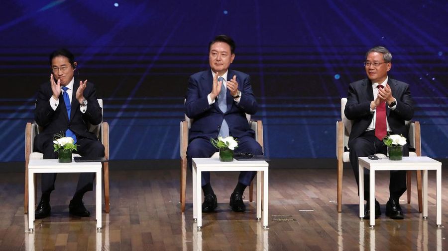 Japanese Prime Minister Fumio Kishida, South Korean President Yoon Suk Yeol and Chinese Premier Li Qiang attend the business summit at the Korea Chamber of Commerce and Industry on May 27, 2024 in Seoul, South Korea.  Chung Sung-Jun/Pool via REUTERS