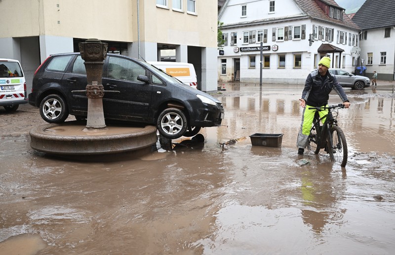 A gold selling shop is under water in a flooded street in the center of Passau in Bavaria, southern Germany, on June 4, 2024. Heavy rains from May 31, 2024 onwards have led to flooding across the southern German states of Baden-Wuerttemberg and Bavaria and that have claimed four lives so far. Thousands of people in these regions had to leave their homes. (Photo by Michaela STACHE / AFP)