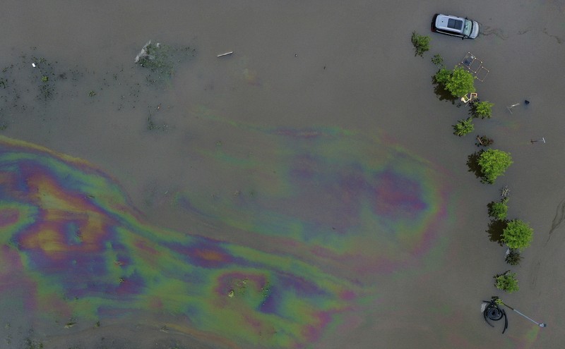 Germany Flooding A car washed away by floodwater rests on a well, in Rudersberg, Germany, Monday, June 3, 2024. Persistent heavy rain led to widespread flooding in the southern states of Bavaria and Baden-Wuerttemberg over the weekend. (Bernd Wei'brod/dpa via AP)