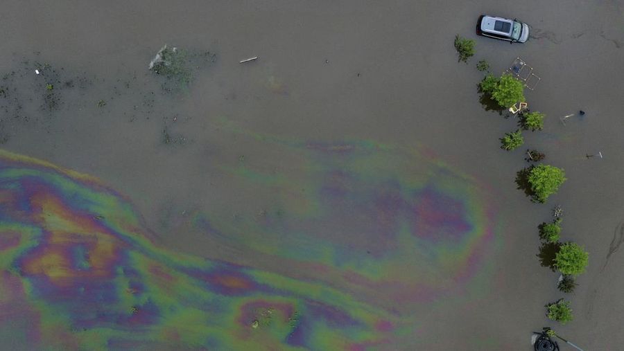 A car washed away by floodwater rests on a well, in Rudersberg, Germany, Monday, June 3, 2024. Persistent heavy rain led to widespread flooding in the southern states of Bavaria and Baden-Wuerttemberg over the weekend. (Bernd Wei'brod/dpa via AP)