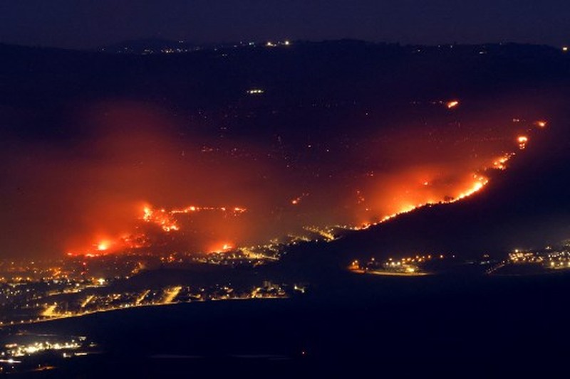 Smoke and fire covers the area following rocket attacks from Lebanon, amid ongoing cross-border hostilities between Hezbollah and Israeli forces, near Kiryat Shmona, Israel, close to its border with Lebanon, June 3, 2024. REUTERS/Ayal Margolin ISRAEL OUT. NO COMMERCIAL OR EDITORIAL SALES IN ISRAEL