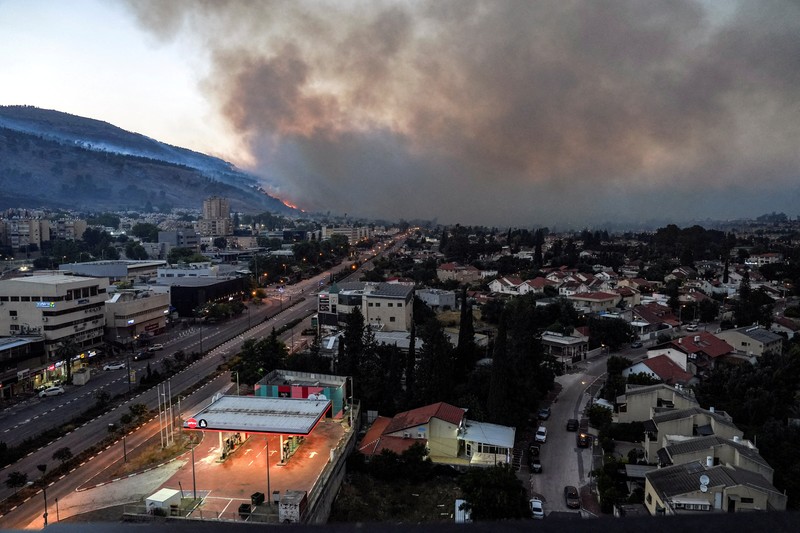 ISRAEL-PALESTINIANS/LEBANON Smoke and fire covers the area following rocket attacks from Lebanon, amid ongoing cross-border hostilities between Hezbollah and Israeli forces, near Kiryat Shmona, Israel, close to its border with Lebanon, June 3, 2024. REUTERS/Ayal Margolin ISRAEL OUT. NO COMMERCIAL OR EDITORIAL SALES IN ISRAEL
