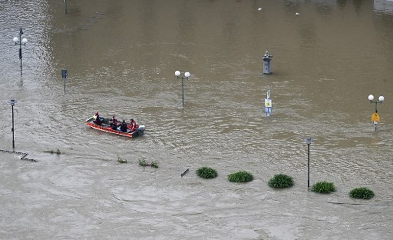 A gold selling shop is under water in a flooded street in the center of Passau in Bavaria, southern Germany, on June 4, 2024. Heavy rains from May 31, 2024 onwards have led to flooding across the southern German states of Baden-Wuerttemberg and Bavaria and that have claimed four lives so far. Thousands of people in these regions had to leave their homes. (Photo by Michaela STACHE / AFP)
