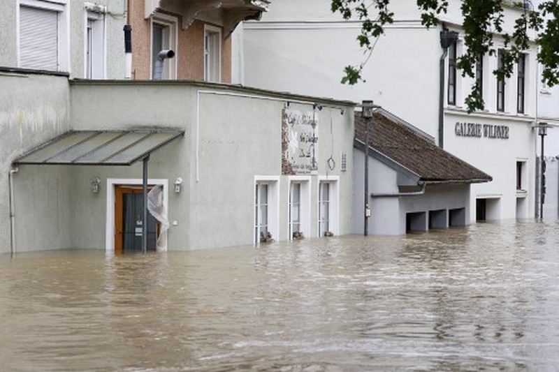 A gold selling shop is under water in a flooded street in the center of Passau in Bavaria, southern Germany, on June 4, 2024. Heavy rains from May 31, 2024 onwards have led to flooding across the southern German states of Baden-Wuerttemberg and Bavaria and that have claimed four lives so far. Thousands of people in these regions had to leave their homes. (Photo by Michaela STACHE / AFP)