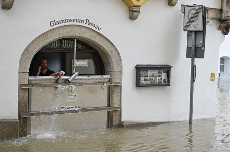 GERMANY-WEATHER-FLOODS A gold selling shop is under water in a flooded street in the center of Passau in Bavaria, southern Germany, on June 4, 2024. Heavy rains from May 31, 2024 onwards have led to flooding across the southern German states of Baden-Wuerttemberg and Bavaria and that have claimed four lives so far. Thousands of people in these regions had to leave their homes. (Photo by Michaela STACHE / AFP)