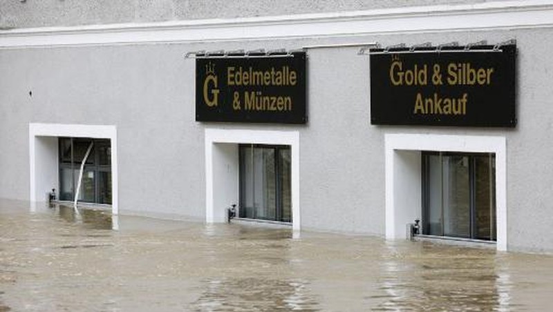 A gold selling shop is under water in a flooded street in the center of Passau in Bavaria, southern Germany, on June 4, 2024. Heavy rains from May 31, 2024 onwards have led to flooding across the southern German states of Baden-Wuerttemberg and Bavaria and that have claimed four lives so far. Thousands of people in these regions had to leave their homes. (Photo by Michaela STACHE / AFP)
