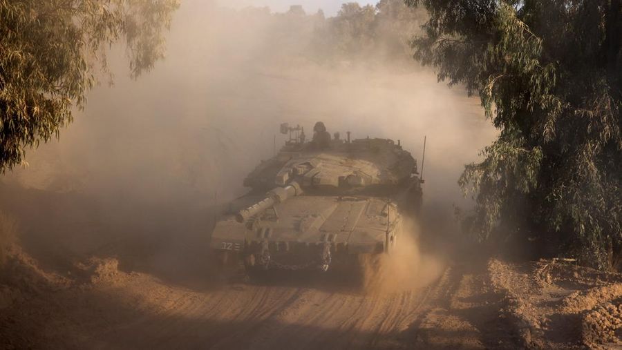 An Israeli soldier stands in a tank, amid the ongoing conflict between Israel and Hamas, near the Israel-Gaza border, in Israel, June 4, 2024. REUTERS/Amir Cohen     TPX IMAGES OF THE DAY