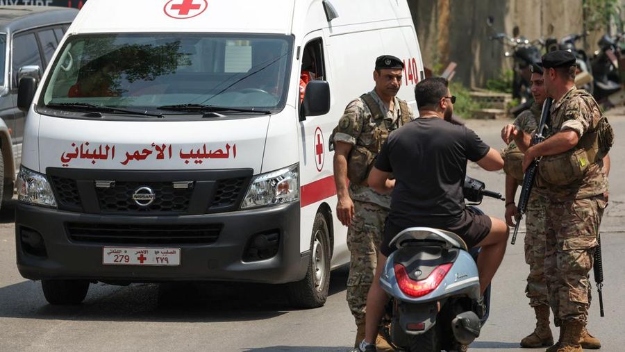A Lebanese Red Cross vehicle drives by Lebanese army soldiers, near the U.S. embassy in Awkar, Lebanon June 5, 2024. REUTERS/Mohamed Azakir