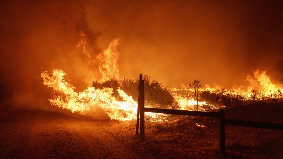 Firefighters work against the advancing Post Fire on Sunday, June 16, 2024, in Gorman, Calif. (AP Photo/Eric Thayer)