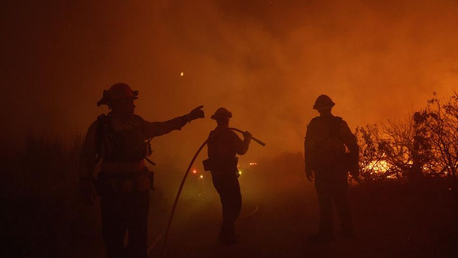 Firefighters work against the advancing Post Fire on Sunday, June 16, 2024, in Gorman, Calif. (AP Photo/Eric Thayer)