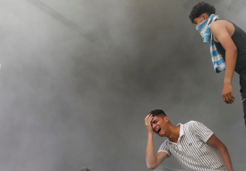 RELIGION-EID/PALESTINIANS-GAZA A Palestinian man reaches to products at a stall, ahead of Eid-al-Adha, amid the Israel-Hamas conflict, in Deir Al-Balah, in central Gaza Strip June 15, 2024. REUTERS/Ramadan Abed