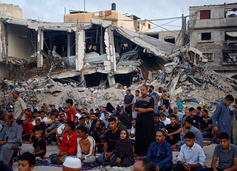 Palestinians pray on the first day of the Muslim holiday of Eid al-Adha on the Al-Aqsa compound, also known to Jews as the Temple Mount, in Jerusalem's Old City June 16, 2024. REUTERS/Ammar Awad