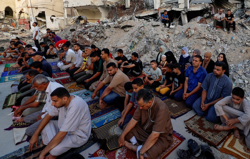 Palestinians pray on the first day of the Muslim holiday of Eid al-Adha on the Al-Aqsa compound, also known to Jews as the Temple Mount, in Jerusalem's Old City June 16, 2024. REUTERS/Ammar Awad