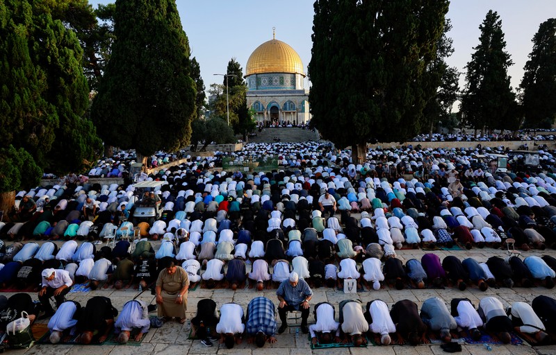Palestinians pray on the first day of the Muslim holiday of Eid al-Adha on the Al-Aqsa compound, also known to Jews as the Temple Mount, in Jerusalem's Old City June 16, 2024. REUTERS/Ammar Awad