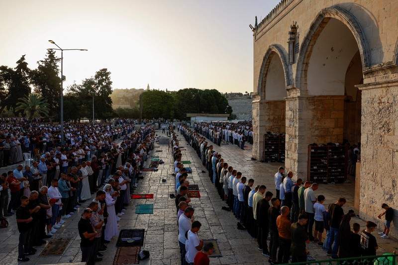 Palestinians pray on the first day of the Muslim holiday of Eid al-Adha on the Al-Aqsa compound, also known to Jews as the Temple Mount, in Jerusalem's Old City June 16, 2024. REUTERS/Ammar Awad