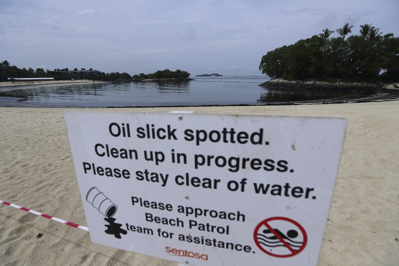 Singapore Oil Spill A general view of oil spill along Sentosa's Tanjong Beach area in Singapore, Sunday, June 16, 2024. (AP Photo/Suhaimi Abdullah)