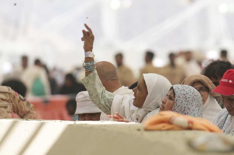 Saudi Arabia Hajj Muslim pilgrims arrive to cast stones at pillars in the symbolic stoning of the devil, the last rite of the annual hajj, in Mina, near the holy city of Mecca, Saudi Arabia, Sunday, June 16, 2024. The ritual marks the final days of the Hajj, or Islamic pilgrimage, and the start of the Eid al-Adha celebrations for Muslims around the world. (AP Photo/Rafiq Maqbool)