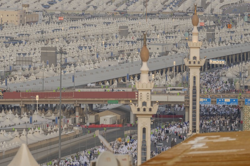 Saudi Arabia Hajj Muslim pilgrims arrive to cast stones at pillars in the symbolic stoning of the devil, the last rite of the annual hajj, in Mina, near the holy city of Mecca, Saudi Arabia, Sunday, June 16, 2024. The ritual marks the final days of the Hajj, or Islamic pilgrimage, and the start of the Eid al-Adha celebrations for Muslims around the world. (AP Photo/Rafiq Maqbool)