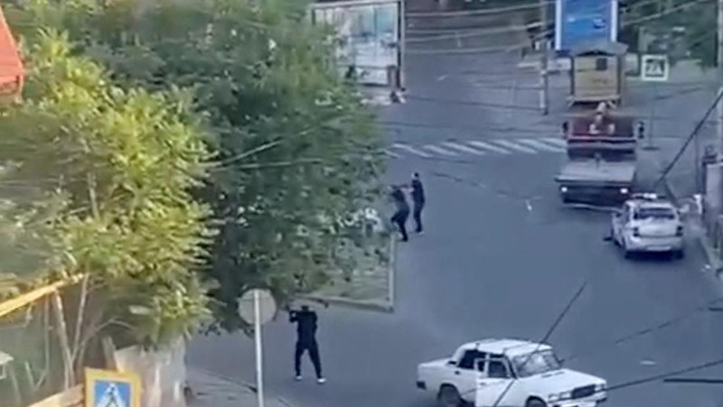 A view shows a shooting scene on the street of Makhachkala, Dagestan, in southern Russia, June 23, 2024, in this still image obtained from a video.  VIDEO OBTAINED BY REUTERS/via REUTERS  THIS IMAGE HAS BEEN SUPPLIED BY A THIRD PARTY. MANDATORY CREDIT. NO RESALES. NO ARCHIVES.