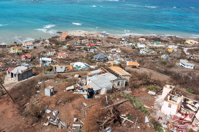 Puing-puing yang berserakan dan rumah-rumah yang atapnya hilang terlihat dalam foto drone setelah Badai Beryl melewati pulau Petite Martinique, Grenada 2 Juli 2024. Puing-puing yang berserakan dan rumah-rumah yang atapnya hilang terlihat dalam foto drone setelah Badai Beryl melewati pulau Petite Martinique, Grenada 2 Juli 2024. (REUTERS/Arthur Daniel)
