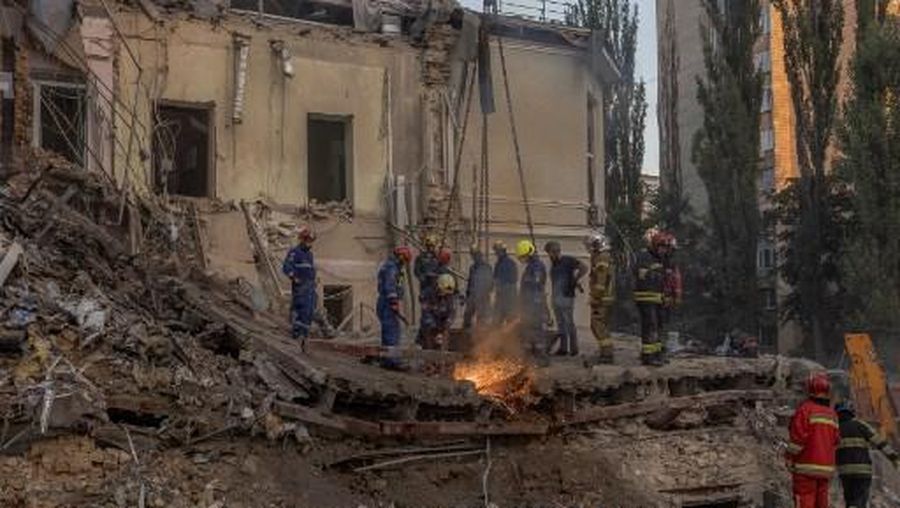 Emergency and rescue personnel operate and clear the rubble of the destroyed building of Ohmatdyt Children's Hospital following a missile strike in the Ukrainian capital of Kyiv on July 8, 2024, amid the Russian invasion of Ukraine. Russia struck cities across Ukraine on July 8, 2024, with a missile barrage that killed three dozen people and ripped open a children's hospital in Kyiv, an assault condemned as a ruthless attack on civilians. (Photo by Roman PILIPEY / AFP)