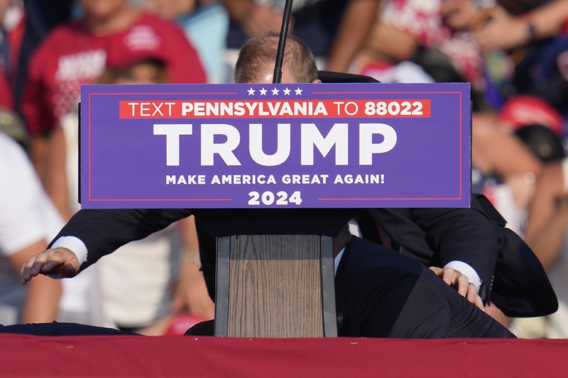People gather for a campaign rally of Republican presidential candidate and former U.S. President Donald Trump at the Butler Farm Show in Butler, Pennsylvania, U.S., July 13, 2024. REUTERS/Brendan McDermid