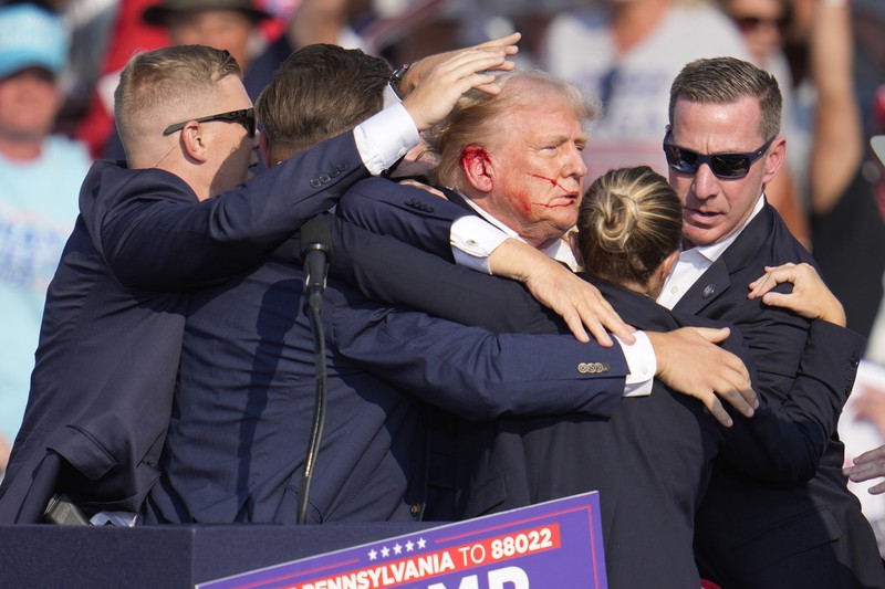 People gather for a campaign rally of Republican presidential candidate and former U.S. President Donald Trump at the Butler Farm Show in Butler, Pennsylvania, U.S., July 13, 2024. REUTERS/Brendan McDermid
