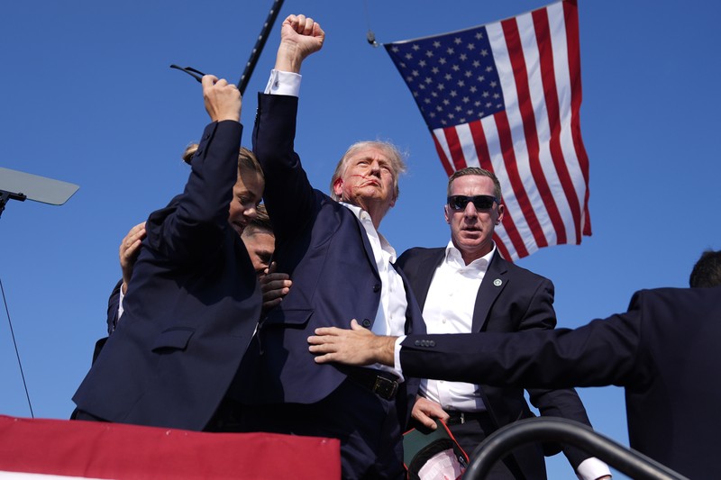 People gather for a campaign rally of Republican presidential candidate and former U.S. President Donald Trump at the Butler Farm Show in Butler, Pennsylvania, U.S., July 13, 2024. REUTERS/Brendan McDermid