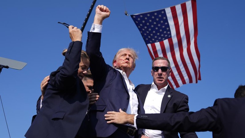 People gather for a campaign rally of Republican presidential candidate and former U.S. President Donald Trump at the Butler Farm Show in Butler, Pennsylvania, U.S., July 13, 2024. REUTERS/Brendan McDermid