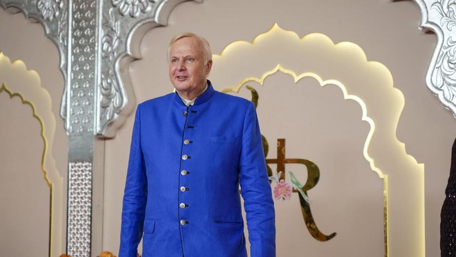 American actor and professional wrestler John Cena gestures as he arrives at the wedding of billionaire Mukesh Ambani's son Anant Ambani and Radhika Merchant at Jio World Convention Centre in Mumbai, India, Friday, July 12, 2024. (AP Photo /Rajanish Kakade)