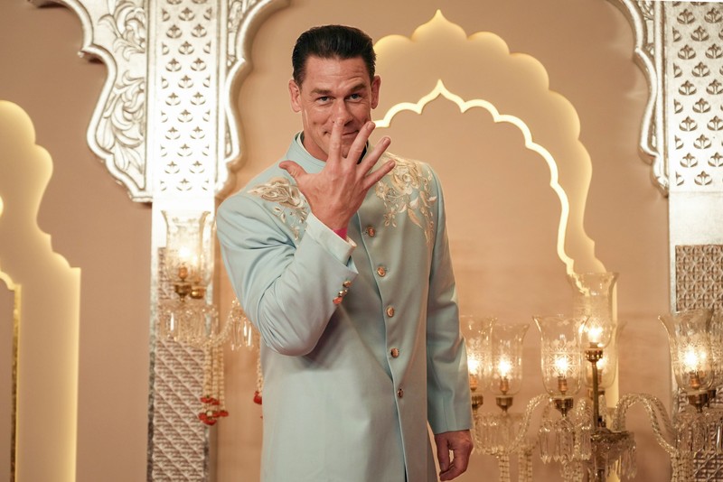 American actor and professional wrestler John Cena gestures as he arrives at the wedding of billionaire Mukesh Ambani's son Anant Ambani and Radhika Merchant at Jio World Convention Centre in Mumbai, India, Friday, July 12, 2024. (AP Photo /Rajanish Kakade)
