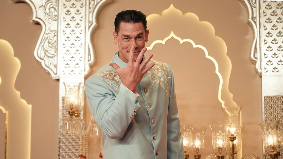 American actor and professional wrestler John Cena gestures as he arrives at the wedding of billionaire Mukesh Ambani's son Anant Ambani and Radhika Merchant at Jio World Convention Centre in Mumbai, India, Friday, July 12, 2024. (AP Photo /Rajanish Kakade)