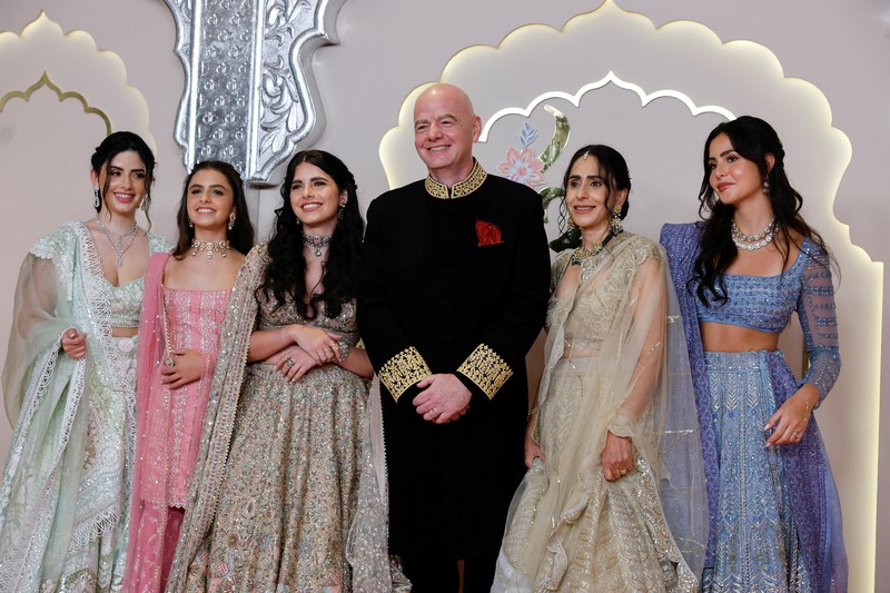 American actor and professional wrestler John Cena gestures as he arrives at the wedding of billionaire Mukesh Ambani's son Anant Ambani and Radhika Merchant at Jio World Convention Centre in Mumbai, India, Friday, July 12, 2024. (AP Photo /Rajanish Kakade)