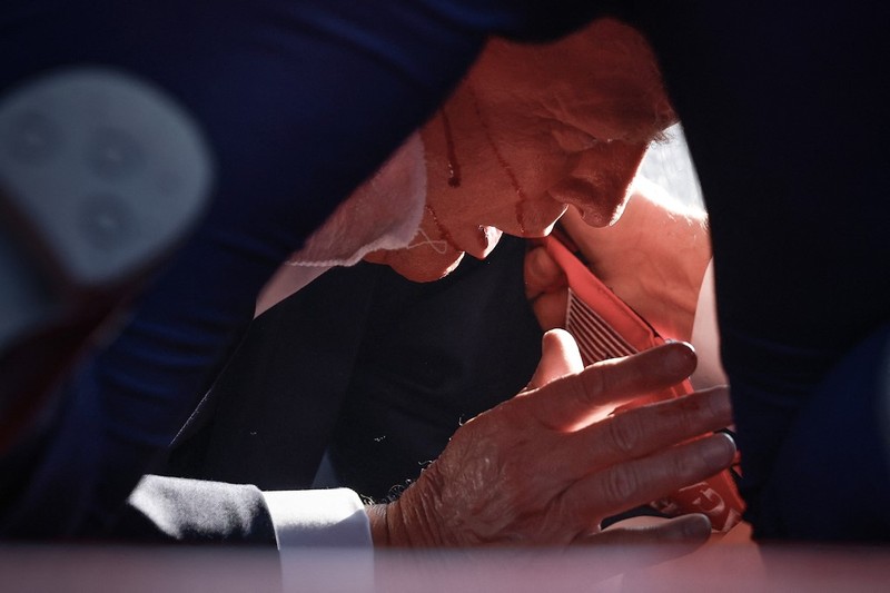 People gather for a campaign rally of Republican presidential candidate and former U.S. President Donald Trump at the Butler Farm Show in Butler, Pennsylvania, U.S., July 13, 2024. REUTERS/Brendan McDermid
