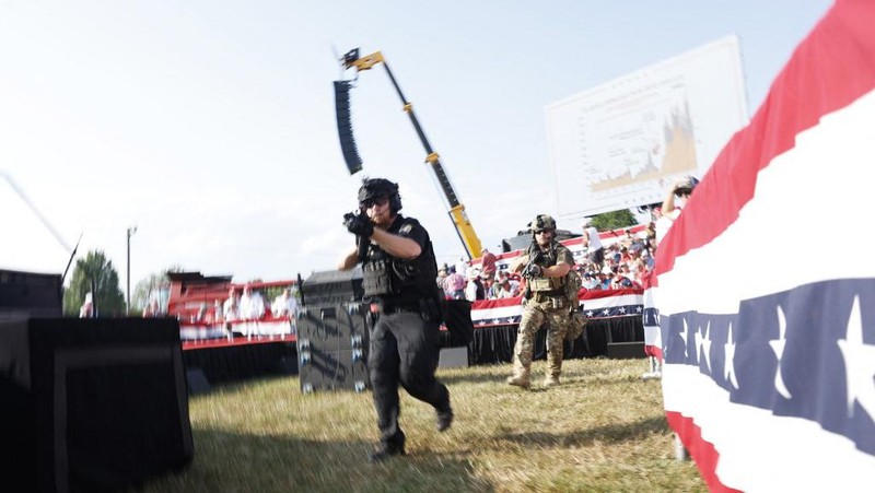 People gather for a campaign rally of Republican presidential candidate and former U.S. President Donald Trump at the Butler Farm Show in Butler, Pennsylvania, U.S., July 13, 2024. REUTERS/Brendan McDermid