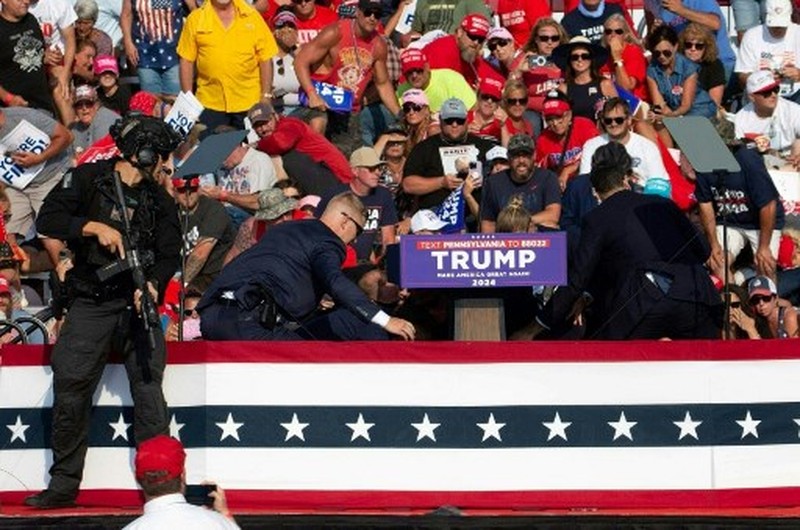 People gather for a campaign rally of Republican presidential candidate and former U.S. President Donald Trump at the Butler Farm Show in Butler, Pennsylvania, U.S., July 13, 2024. REUTERS/Brendan McDermid