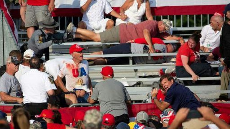 People gather for a campaign rally of Republican presidential candidate and former U.S. President Donald Trump at the Butler Farm Show in Butler, Pennsylvania, U.S., July 13, 2024. REUTERS/Brendan McDermid