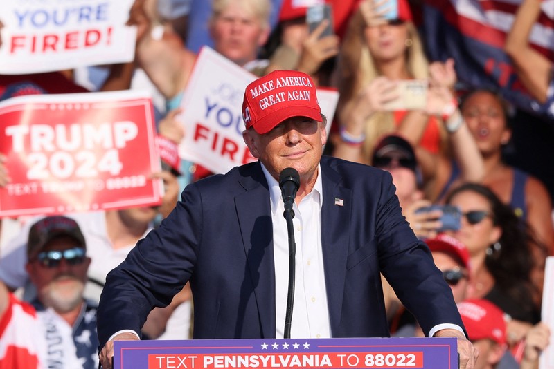 People gather for a campaign rally of Republican presidential candidate and former U.S. President Donald Trump at the Butler Farm Show in Butler, Pennsylvania, U.S., July 13, 2024. REUTERS/Brendan McDermid