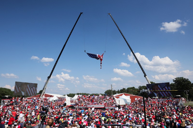 People gather for a campaign rally of Republican presidential candidate and former U.S. President Donald Trump at the Butler Farm Show in Butler, Pennsylvania, U.S., July 13, 2024. REUTERS/Brendan McDermid